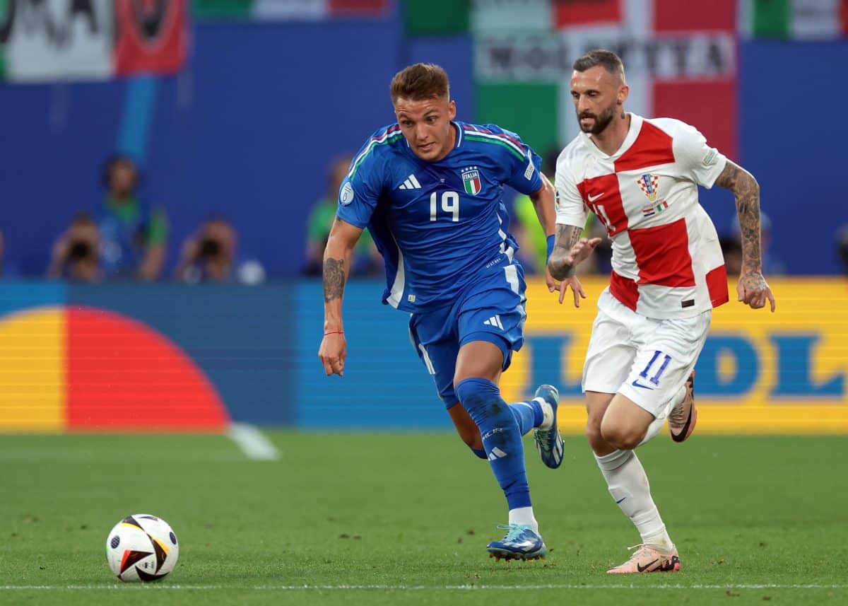 Leipzig, Germany, 24th June 2024. Marcelo Brozovic of Croatia and Mateo Retegui of Italy race for the ball during the UE