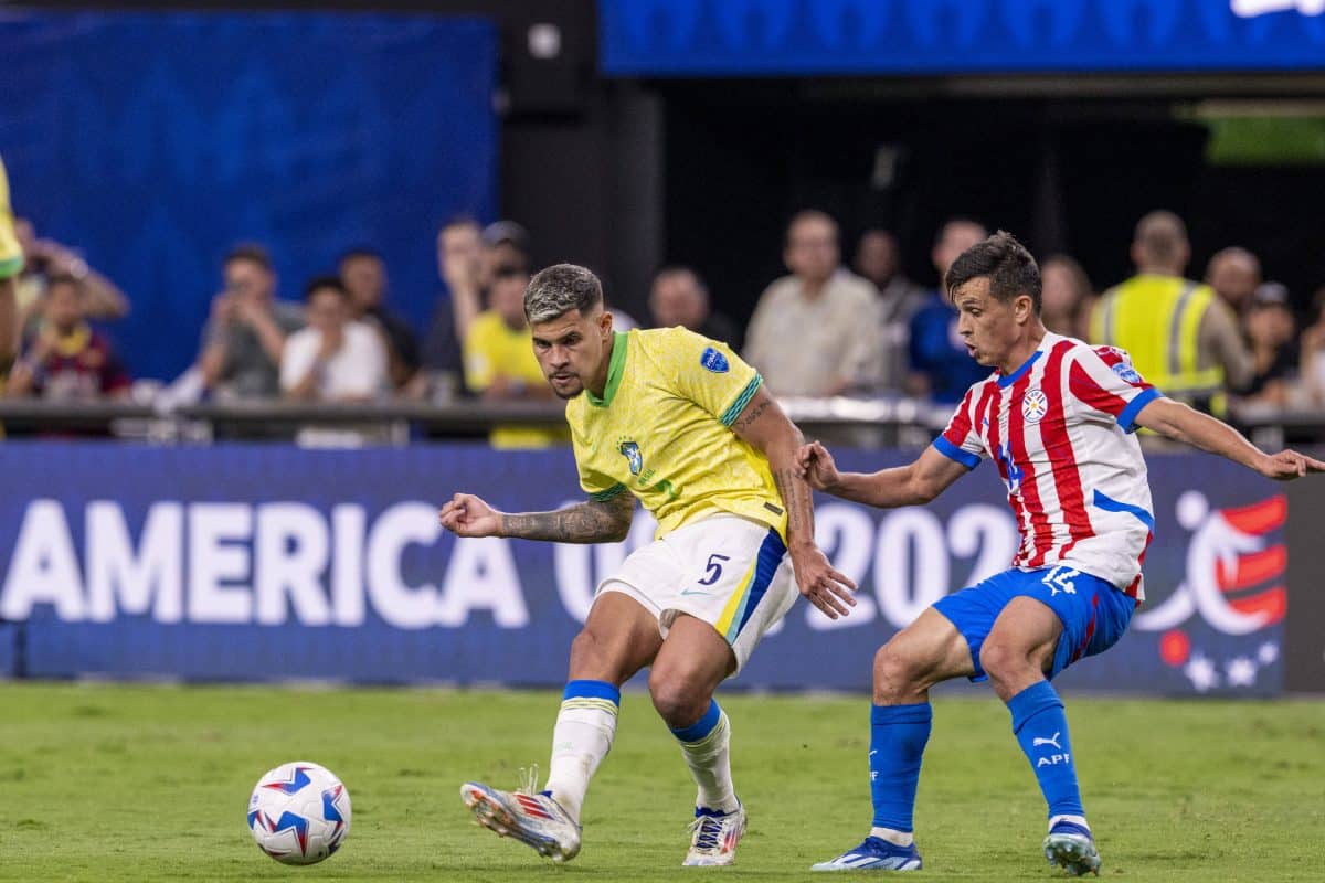 Bruno Guimaraes of Brazil and Andres Cubas of Paraguay during the game between Paraguay and Brazil in the group stage of