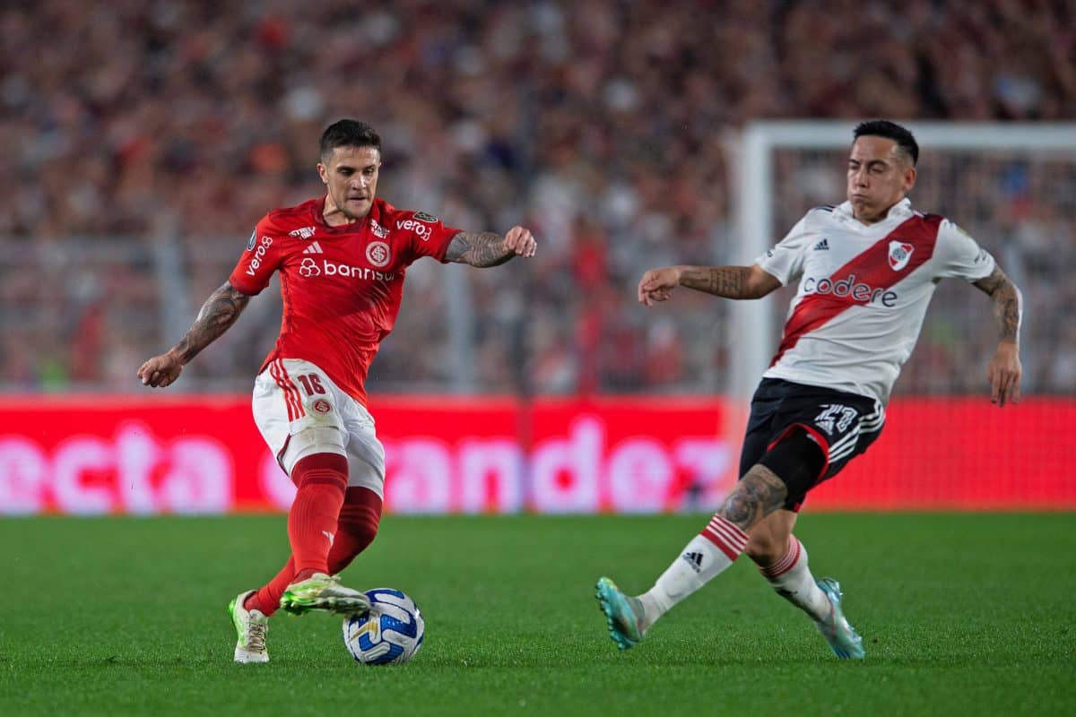 Estadio Monumental de Nunez Esequiel Boat of River Plate competes with Fabricio Bustos of Internacional, during the matc
