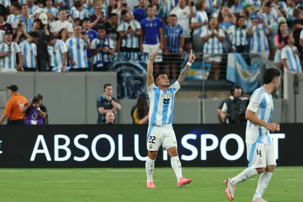 Argentina s forward Lautaro Martinez (C) celebrates after scoring a goal against Chile during the Copa America USA 2024,