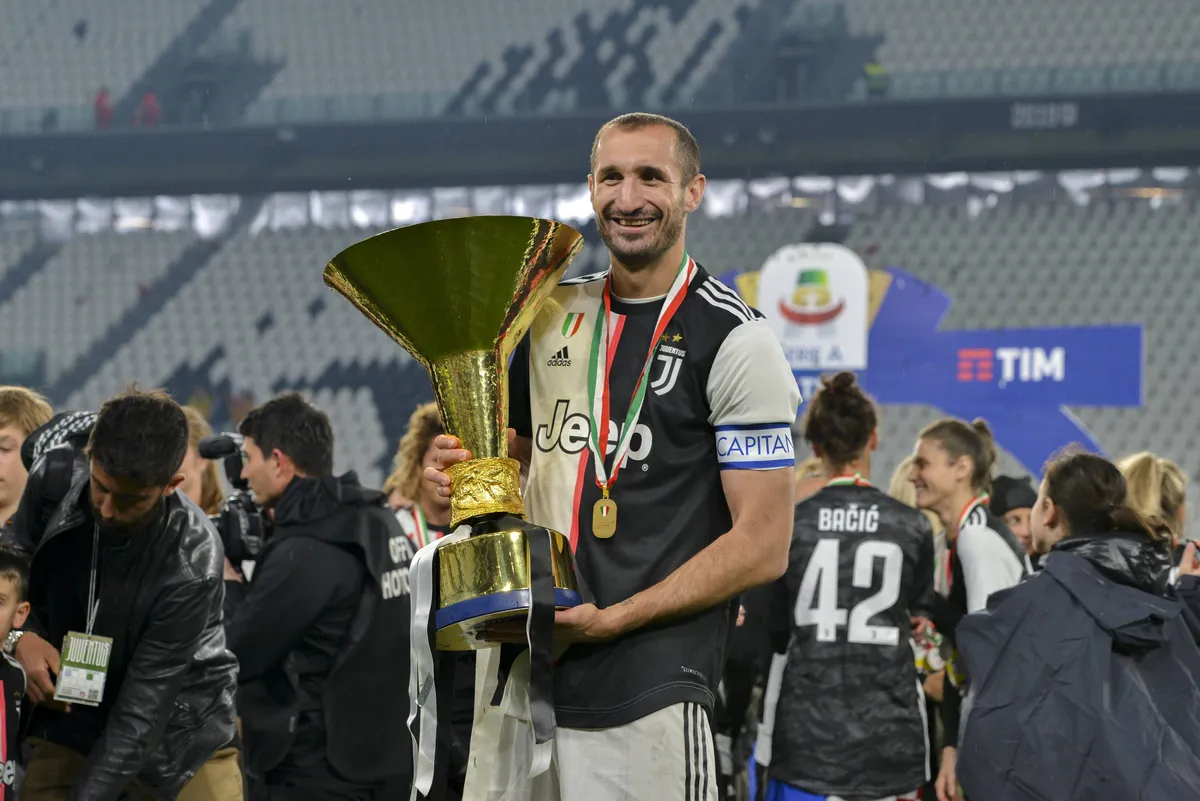 Italy Juventus FC celebrate the trophy of Scudetto Giorgio Chiellini of Juventus FC lifts the trophy
