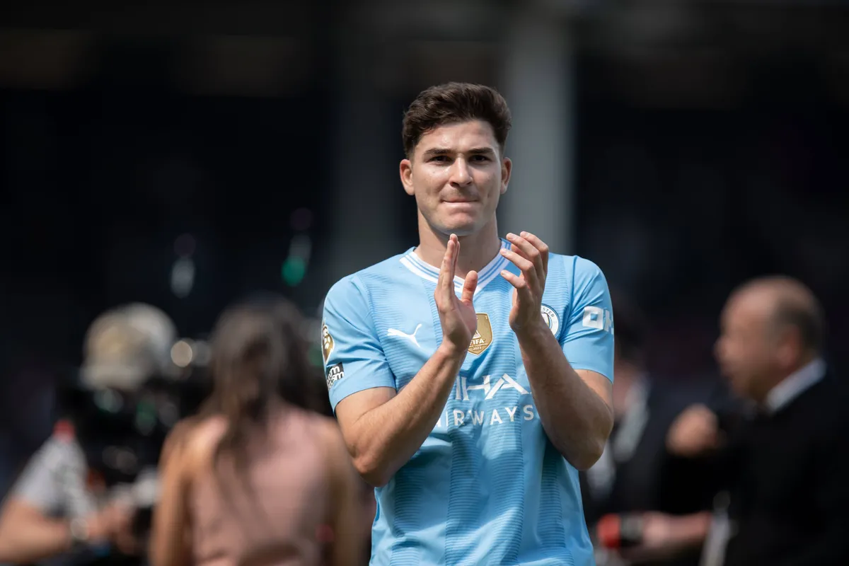 Fulham FC v Manchester City – Premier League Julian Alvarez of Manchester City is applauding their fans after the Premie