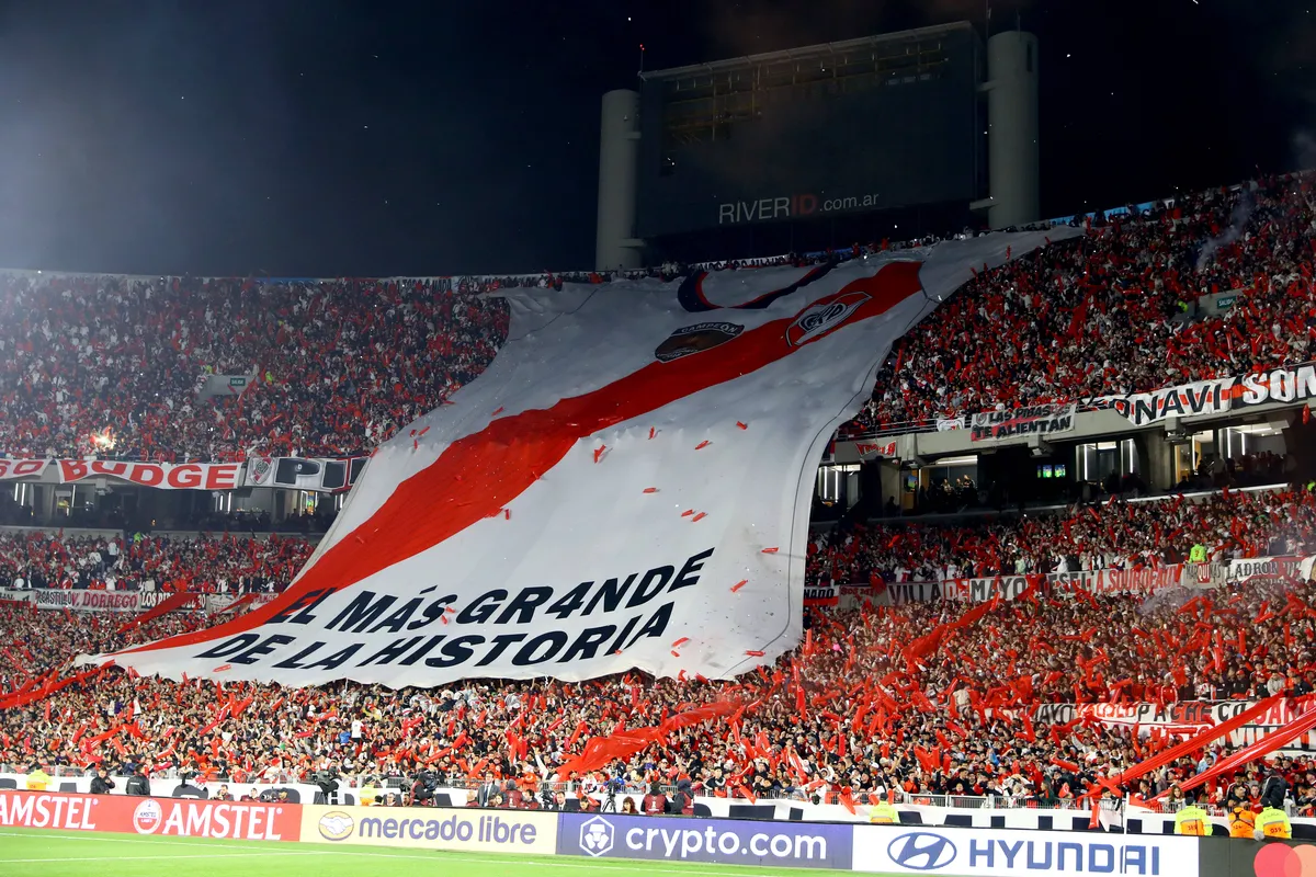 River Plate fans display a large flag as the team s jersey where read: The Greatest in History before the second leg of