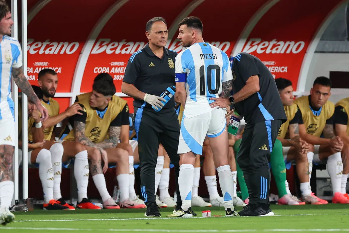 EAST RUTHERFORD, NJ – JUNE 25: Lionel Messi 10 of Argentina has his hamstring treated on the sideline during the first h